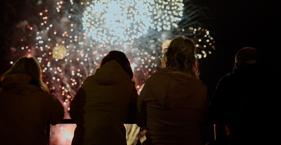 Youths look on at fireworks 